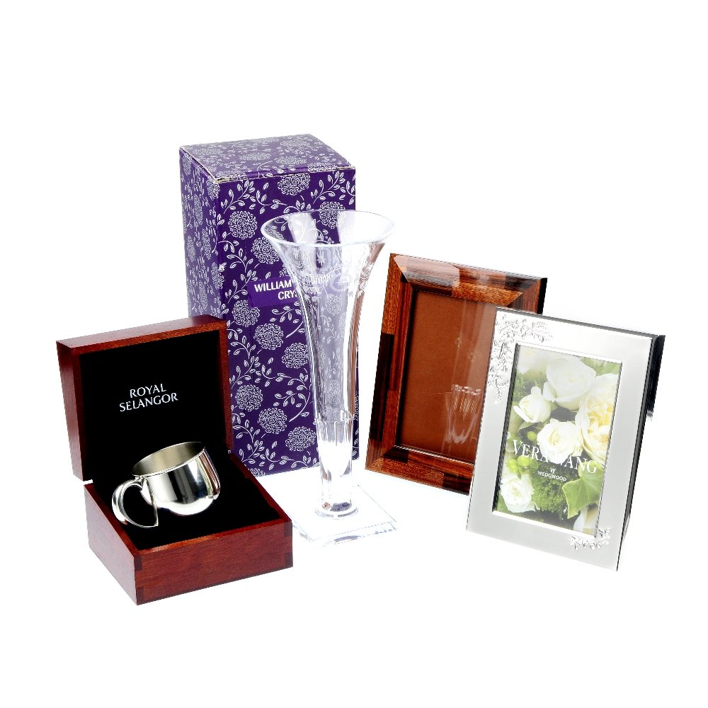 A collection of gift wear.: * A collection of gift wear. To include a silver plated picture frame by Vera Wand for Wedgewood, a tapered glass vase, a christening mug and a further picture frame. Vase incomplete.