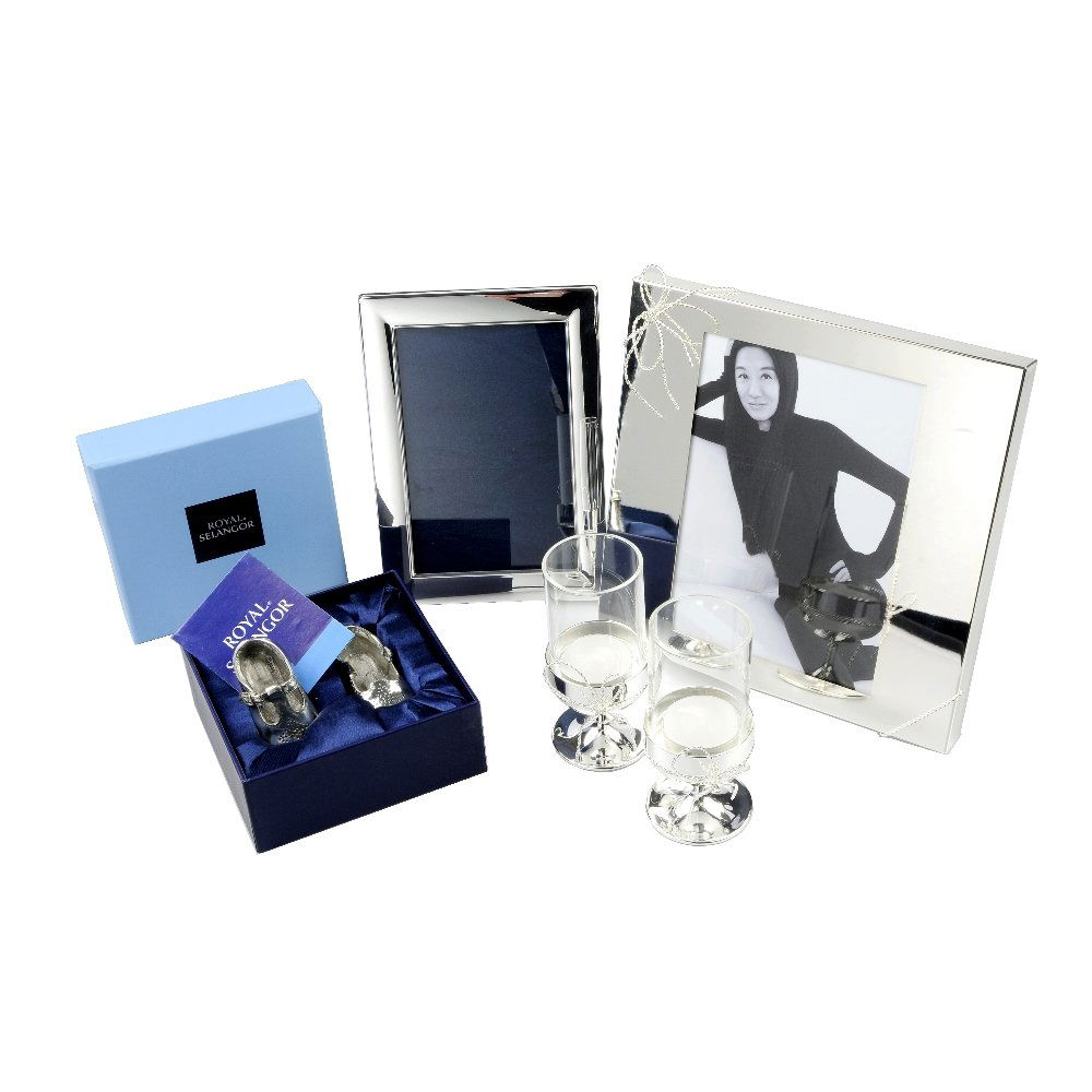 A selection of gift wear.: * A selection of gift wear. To include a Mappin & Webb silver plated picture frame, a pair of silver tea light holders by Vera Wang for Wedgwood, together with three further items. Some AF.