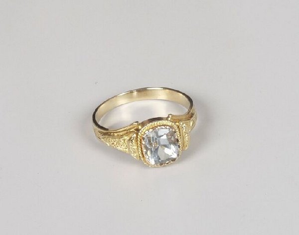 Late Edwardian gold mounted rectangular p: Late Edwardian gold mounted rectangular pale blue topaz single stone dress ring.