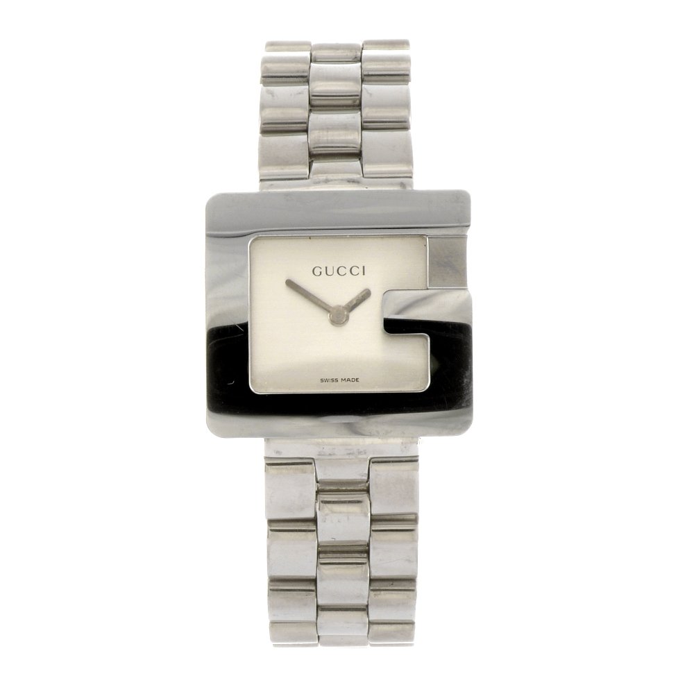 A stainless steel quartz lady's Gucci 3600L bracelet wa: GUCCI - a stainless steel quartz lady's 3600L bracelet watch, the plain silvered dial, rectangular shaped case with G-shaped bezel, fitted to a steel link bracelet with double folding clasp. Case widt