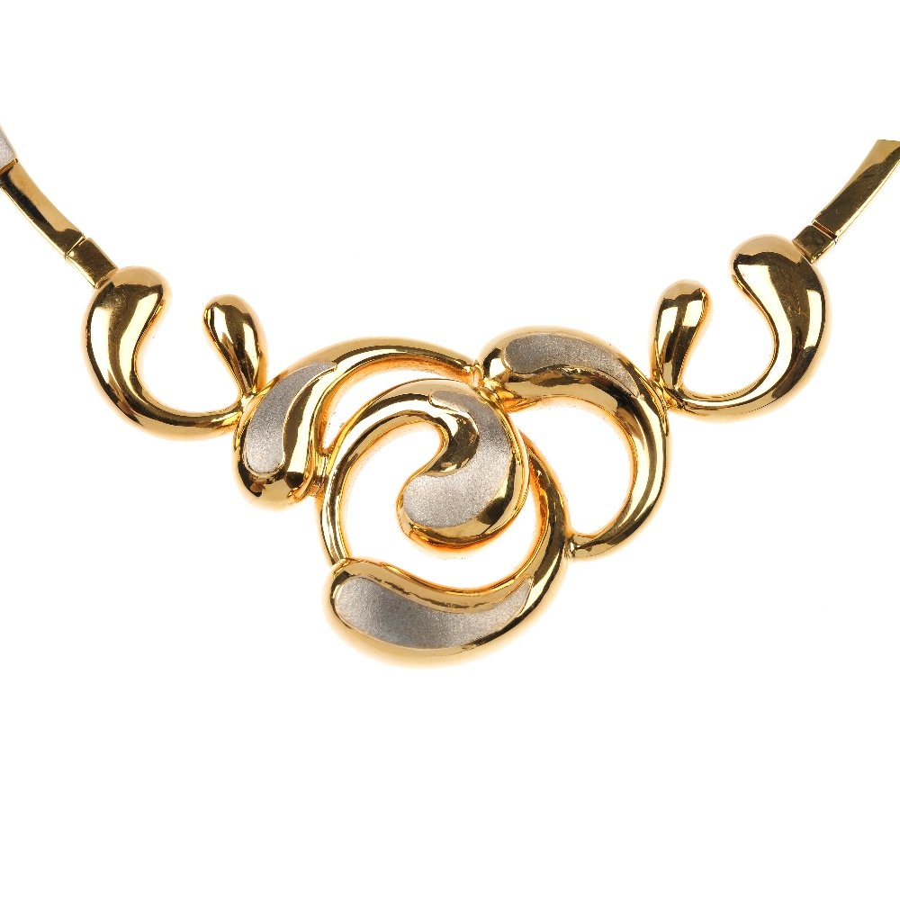 (57127) QUADRI - an 18ct gold suite of jewellery.: (57127) QUADRI - an 18ct gold suite of jewellery. Comprising a necklace, the front design with bi-colour scrolling curve panels to the rectangular-link back chain together with a hinge bangle and a pa
