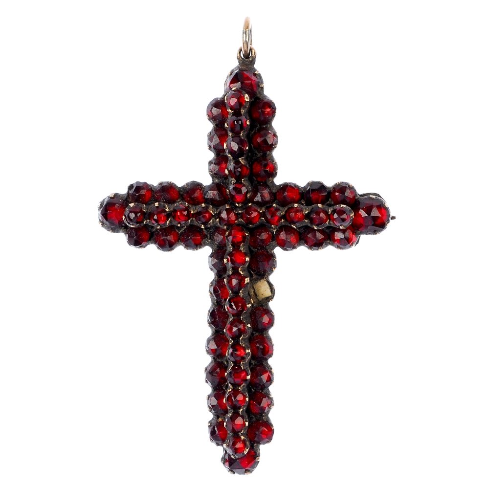 A late 19th century paste cross pendant and bangle.: Two items of late 19th century paste jewellery, to include a red paste cross pendant/brooch and a red paste hinged bangle. Eight pastes deficient. Length of pendant 4.5cms. Inner diameter of bangle 5.