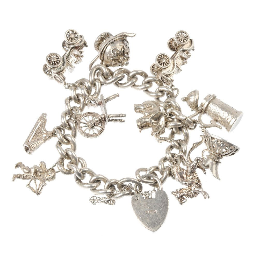Three charm bracelets. Total weight 155gms.: A selection of three charm bracelets, designed as a selection of twenty-nine charms, to include a stork carrying a baby and an enamel Welsh woman, suspended from curb-link and trace-link chains. Thirt