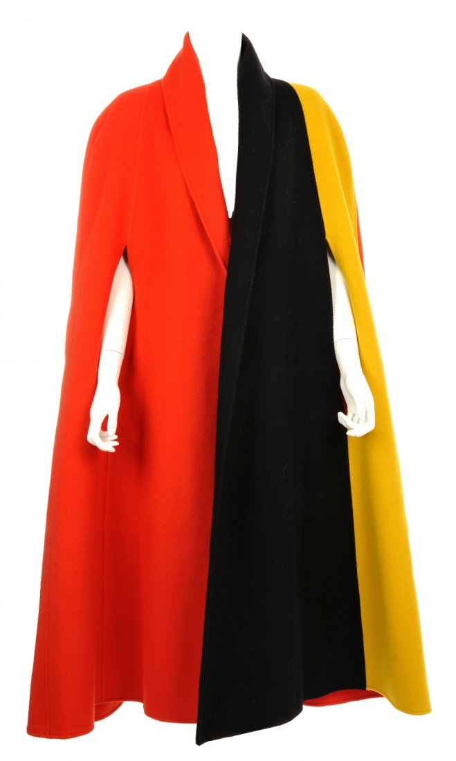 CHRISTIAN LACROIX - a multi-colour cloak.: CHRISTIAN LACROIX - a multi block colour sleeveless cloak, with a rolled collar. Labelled 100% wool made in Italy. Believed to be a large.