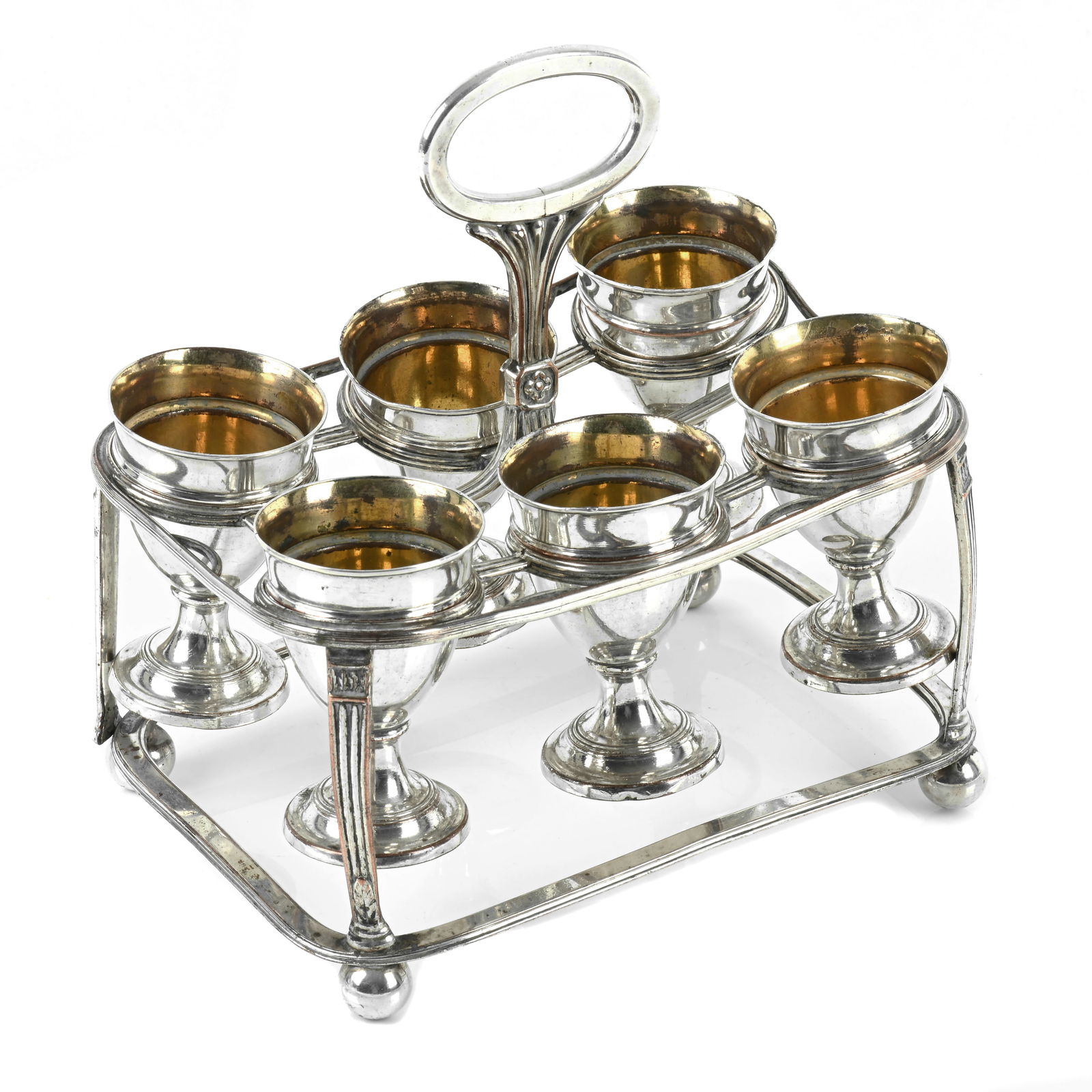 Old Sheffield Plate egg cruet.: Old Sheffield Plate egg cruet. An Old Sheffield Plate egg cruet, the oblong wire frame with reeded decoration supporting six egg cups upon ball feet, lacking spoons, each egg cup struck to the undersi