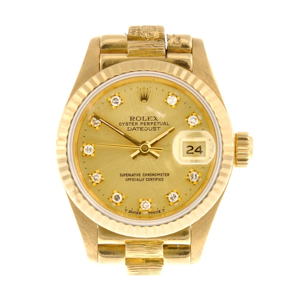 An 18k gold automatic lady's Rolex Datejust bracelet wa: ROLEX - an 18k gold automatic lady's Oyster Perpetual Datejust bracelet watch, the customised afterset champagne tone dial with diamond dot markers, bordered by a minute track, date aperture set to th
