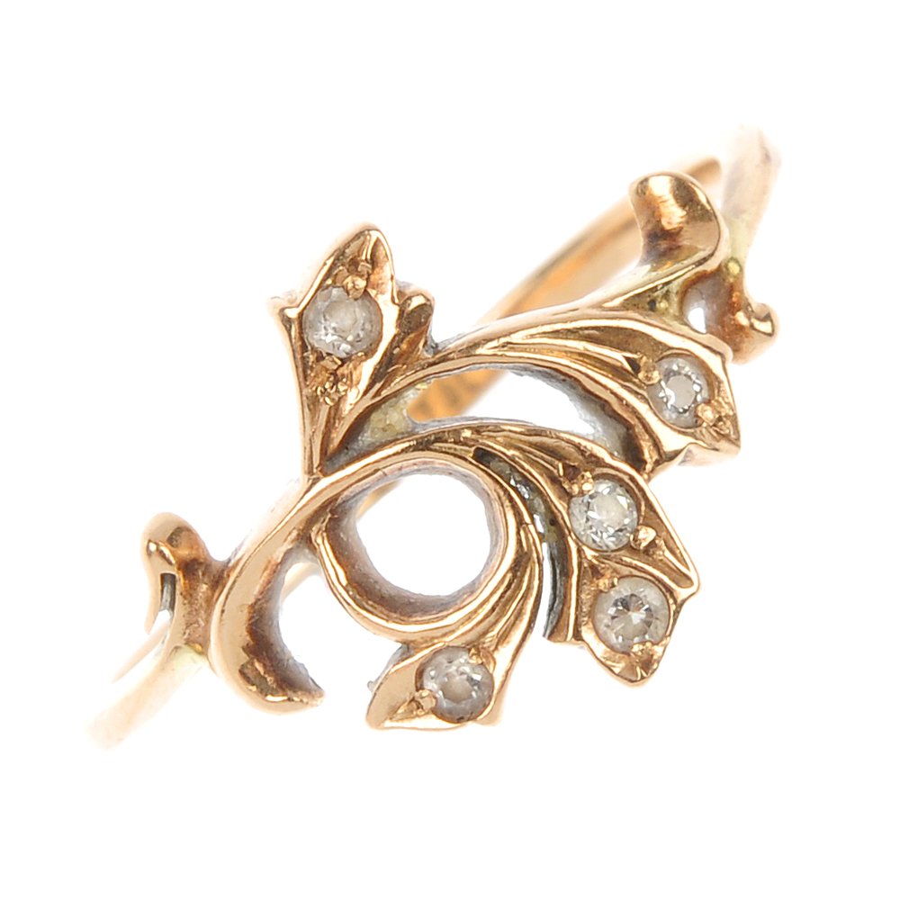 A paste foliate dress ring.: A paste foliate dress ring. Designed as a scrolling leaf with circular-shape paste highlights. Possible Russian marks to outer band, partially rubbed. Weight 2.1gms.