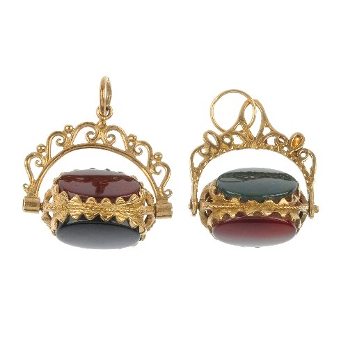 Two 9ct gold hardstone swivel fobs.: Two 9ct gold hardstone swivel fobs. Each set with carnelian, bloodstone and onyx, to the scrolling pedestal. Hallmarks for Birmingham. Length 2.4cms.
