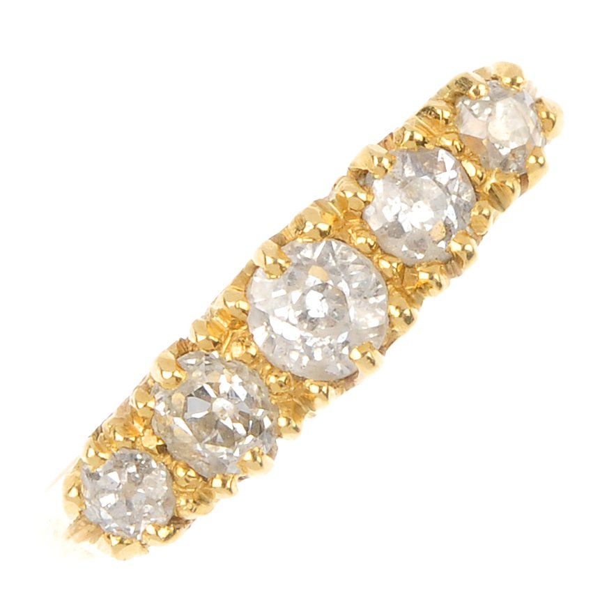 A mid 20th century 18ct gold diamond five-stone ring.: A mid 20th century 18ct gold diamond five-stone ring. Designed as a graduated old-cut diamond line, to the scrolling gallery and plain band. Estimated total diamond weight 0.60ct. Weight 3.6gms.