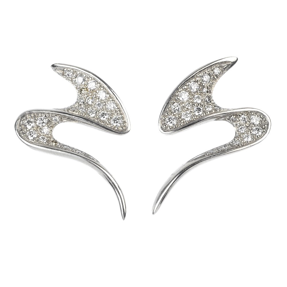 SARAH JORDAN - a pair of platinum 'Fantasia' ear studs.: SARAH JORDAN - a pair of platinum diamond 'Fantasia' ear studs. Each designed as a pave-set diamond abstract line. Maker's mark for Sarah Jordan. Estimated total diamond weight 0.60ct. Hallmarks for L