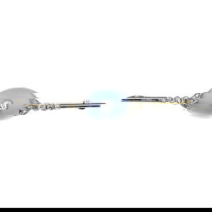 Platinum and gold moonstone and diamond brooch: Platinum and gold moonstone and diamond brooch Estimated total diamond weight 0.10ct. Condition Report: Surface scratches and minor marks.Diamonds appear bright and well matched.Individual size