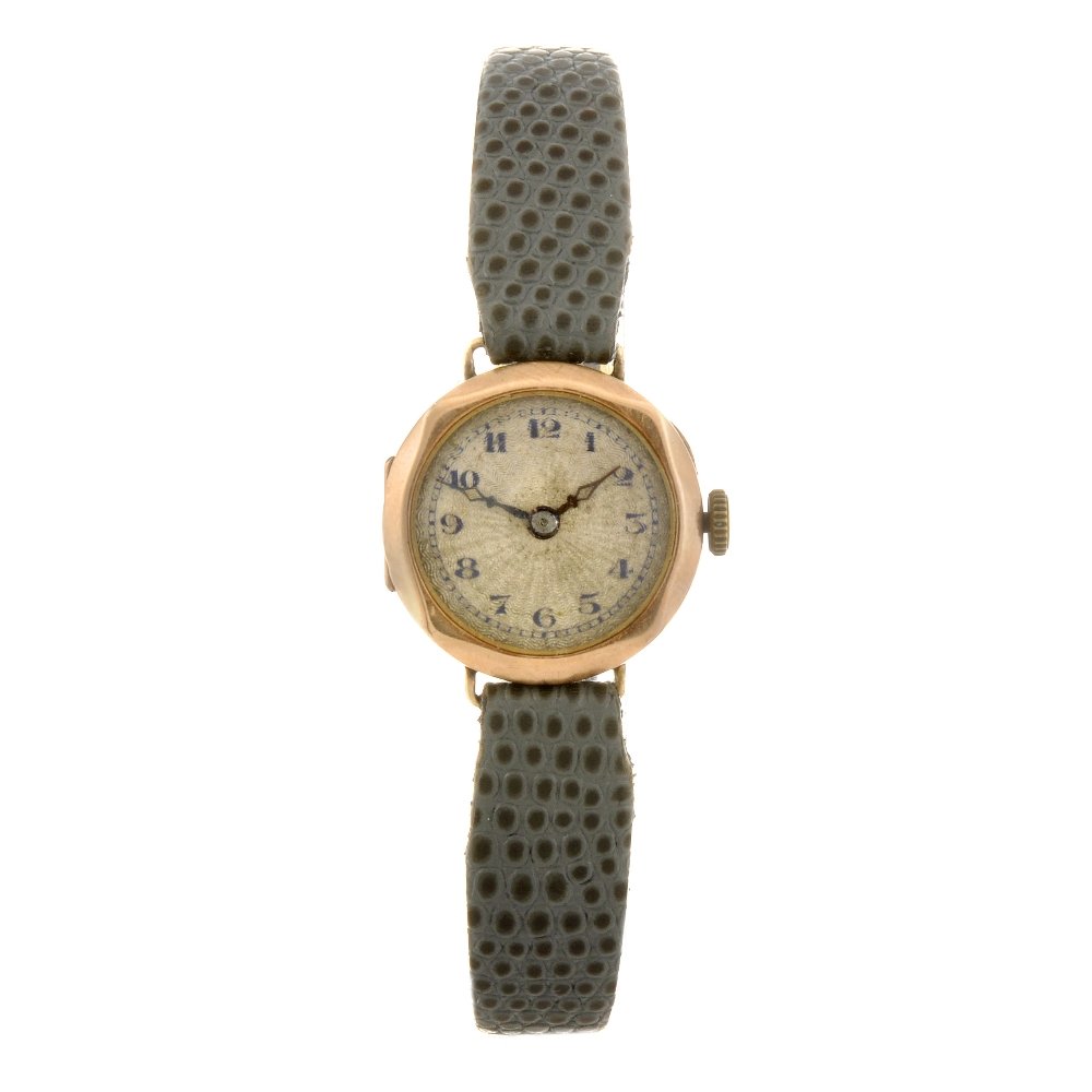 A 9ct gold manual wind lady's wrist watch.: A 9ct gold manual wind lady's wrist watch, the silvered guillochï¿½ effect dial with hourly applied black Arabic numerals, bordered by a minute track, circular shaped case, import hallmarks for Lon