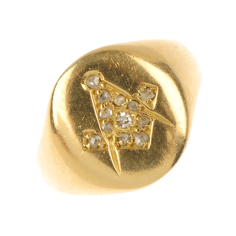 An early 20th century 18ct gold diamond set Masonic sig: An early 20th century 18ct gold diamond set Masonic signet ring. The single and rose-cut diamond Masonic symbol, to the oval-shape panel and tapered shoulders. Hallmarks for Chester, 1918. Weight 6gms