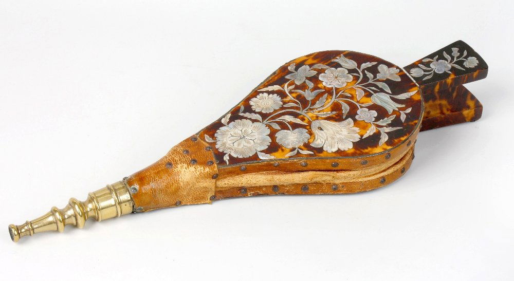 A pair of 19th century tortoiseshell and mother of pear: A pair of 19th century tortoiseshell and mother of pearl veneered bellows, the tortoiseshell veneered front with inlaid mother of pearl floral decoration, with brown leather bellows and brass nozzle,