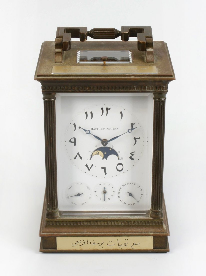 A Matthew Norman four-dial repeating carriage clock: A Matthew Norman four-dial repeating carriage clock. For the Arabic market, having a modern Arabic dial with moon hands framing rolling moon phase with lunar calendar scale, all above three Arabic scr