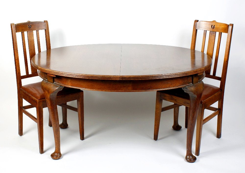 A mixed group of furniture: A mixed group of furniture to include; a 1920's oak draw-out extending dining table on cabriole legs; a set of six (5 plus 1 arm) Arts & Crafts style dining chairs with drop-in seats, an Arts & Crafts
