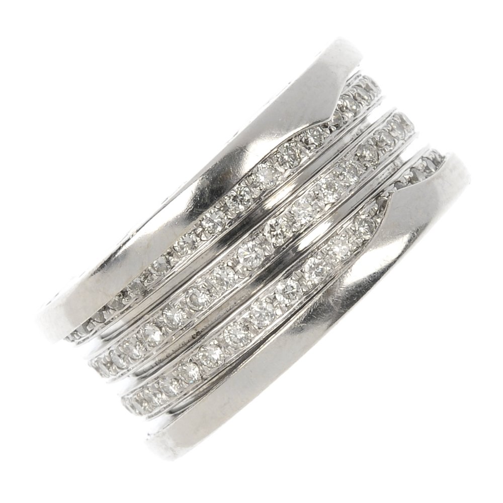 BULGARI - a diamond 'B.Zero 1' ring.: BULGARI - a diamond 'B.Zero 1' ring. The brilliant-cut diamond articulated band, with Bulgari logo sides. Signed Bulgari. Estimated total diamond weight 1ct. Ring size L. Weight 14.5gms.
