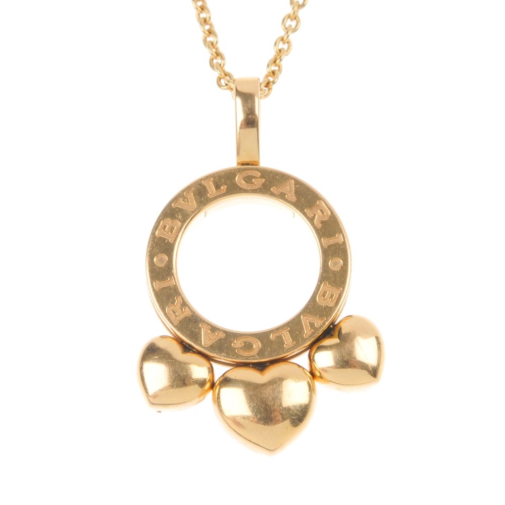 BULGARI - a 'B.Zero 1' heart necklace.: BULGARI - a 'B.Zero 1' heart necklace. Designed as three graduated hearts, rotating to the Bulgari logo circle and plain surmount, suspended from a belcher-link chain with Bulgari logo disc spacers. S