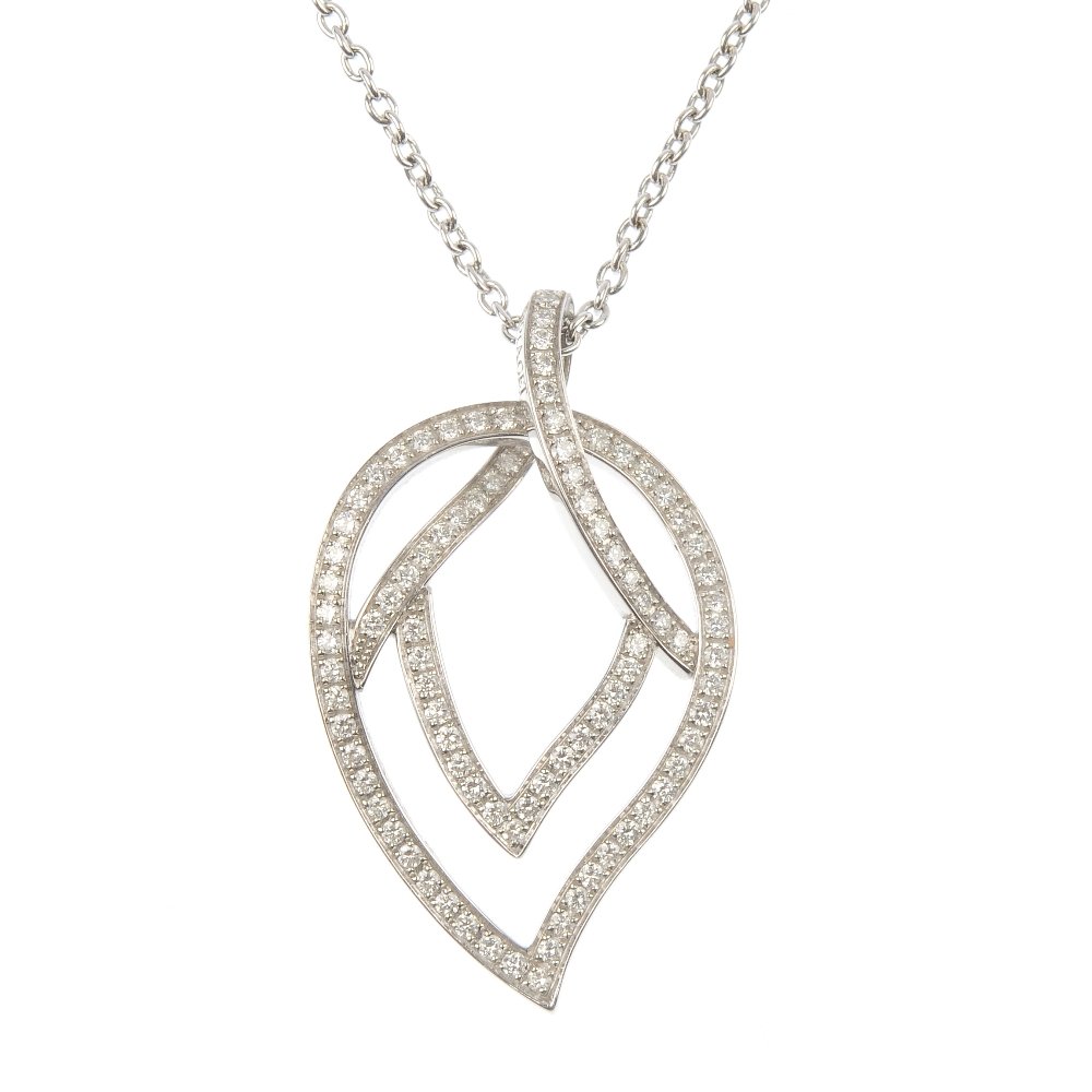 PIAGET - an 18ct gold diamond leaf pendant.: * PIAGET - an 18ct gold diamond leaf pendant. Of openwork design, the brilliant-cut diamond stylised leaf, suspended from a belcher-link chain. Signed Piaget. Estimated total diamond weight 0.90ct, H-