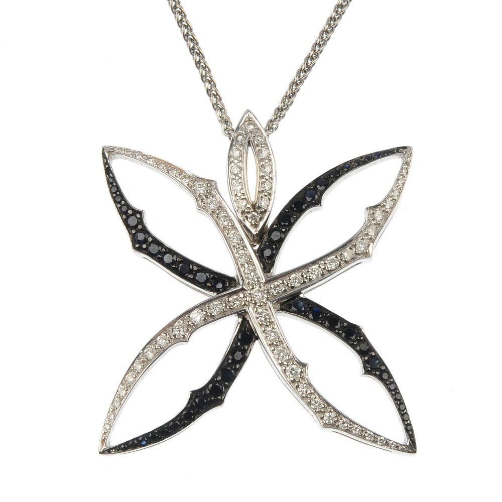 STEPHEN WEBSTER - an 18ct gold diamond and sapphire 'At: * STEPHEN WEBSTER - an 18ct gold diamond and sapphire 'Attention Seeker' pendant. The brilliant-cut diamond and circular-shape sapphire interlocking stylised star, to the brilliant-cut diamond marquis