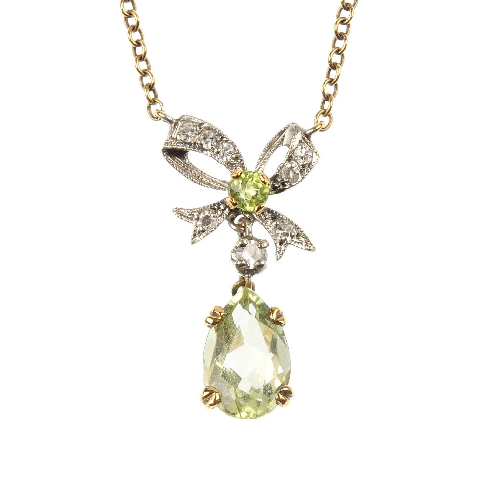 A 9ct gold green-gem and diamond pendant and a labrador: * A 9ct gold green-gem and diamond pendant and a labradorite necklace. To include a vari-cut green-gem and single-cut diamond bow pendant, suspended from a belcher-link chain and a labradorite bead fo