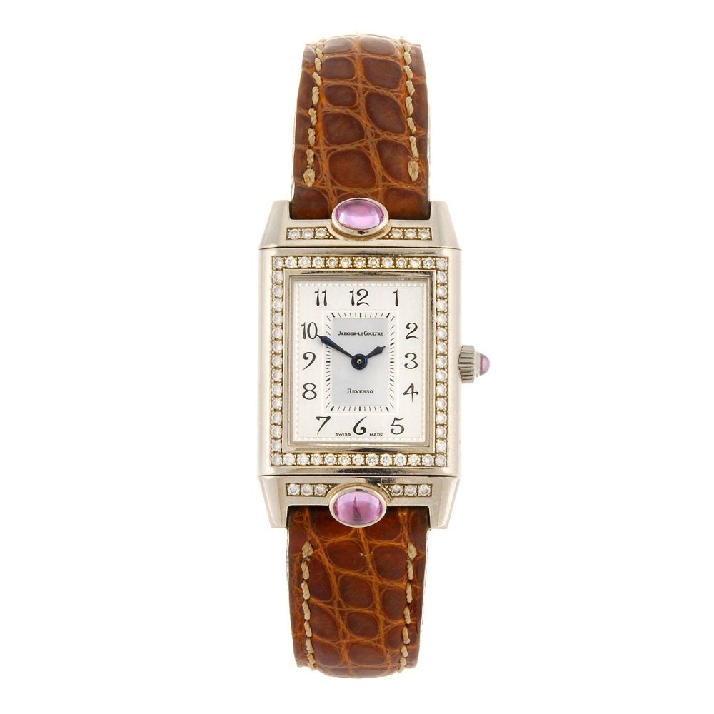 (104003) An 18k white gold manual wind Jaeger-LeCoultre: (104003) JAEGER LECOULTRE - an 18k white gold manual wind Reverso wrist watch, the silvered dial with mother-of-pearl centre, hourly applied Arabic numerals, inner minute track, the reversible rectang