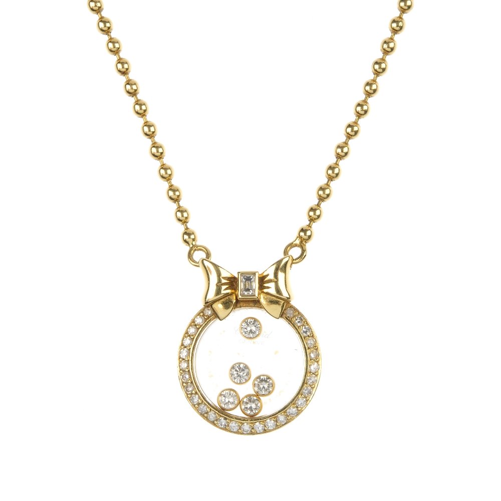CHOPARD - a 'Happy Diamonds' pendant.: CHOPARD - a 'Happy Diamonds' pendant. Designed as five brilliant-cut diamond free-moving collets, within a single-cut diamond circular-shape surround, to the baguette-cut diamond bow surmount and bead