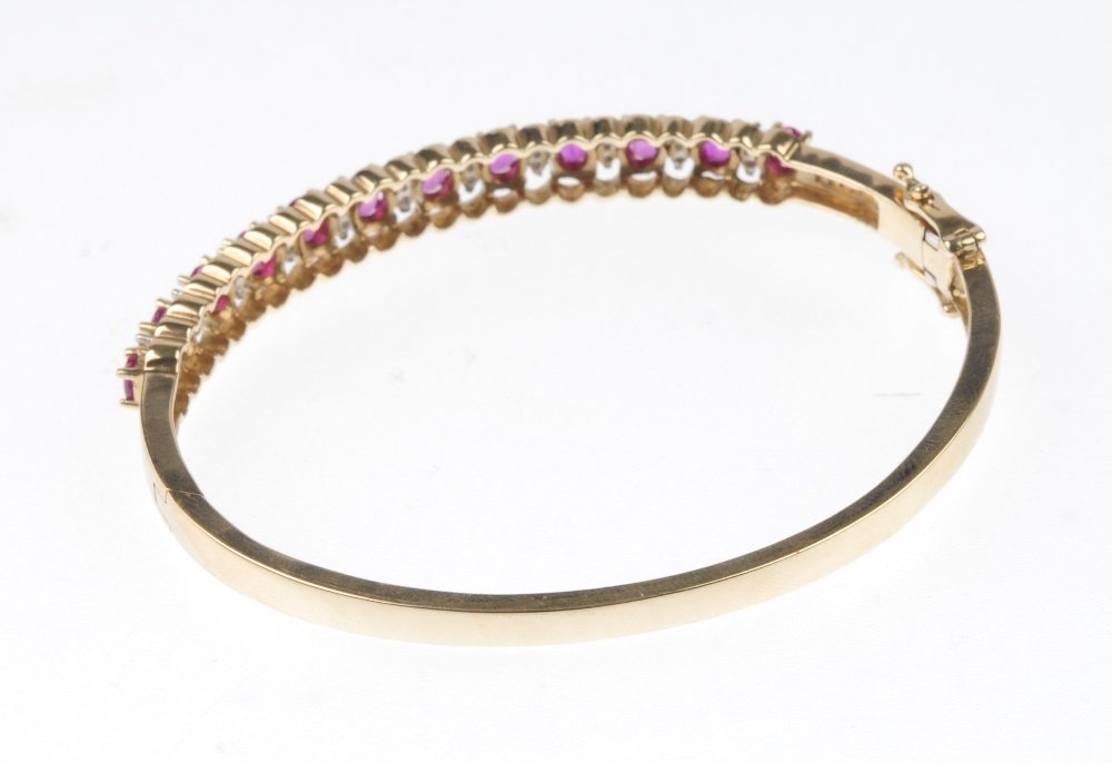 A ruby and diamond hinged bangle. - 3