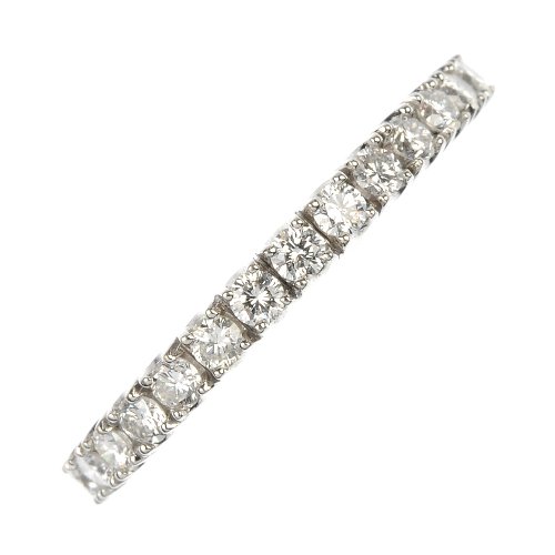 A diamond half-circle eternity ring.: A diamond half-circle eternity ring. The brilliant-cut diamonds, to the plain band. Estimated total diamond weight 0.75ct. Weight 3.4gms.