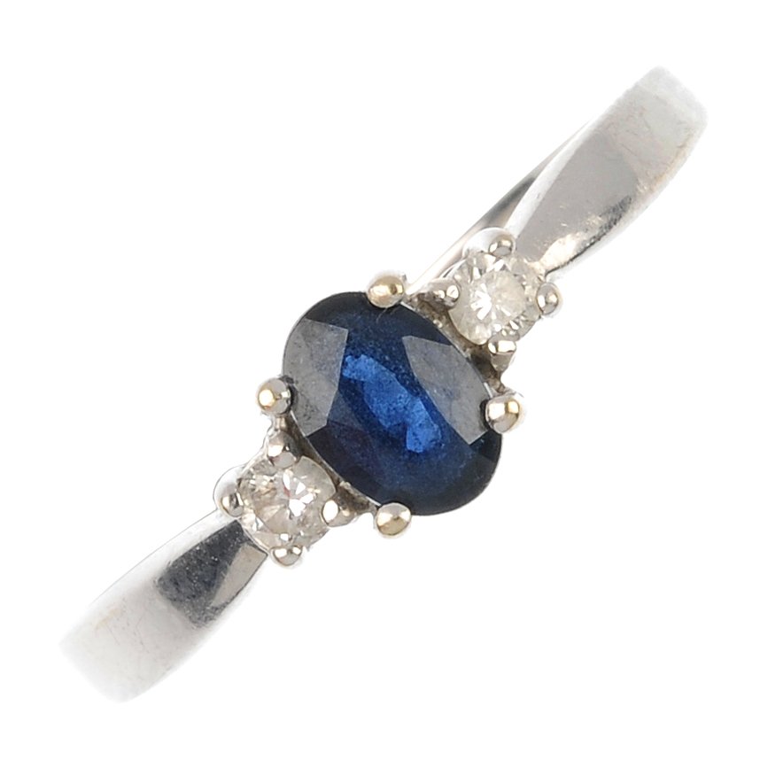(18277) A 9ct gold diamond and sapphire three-stone rin