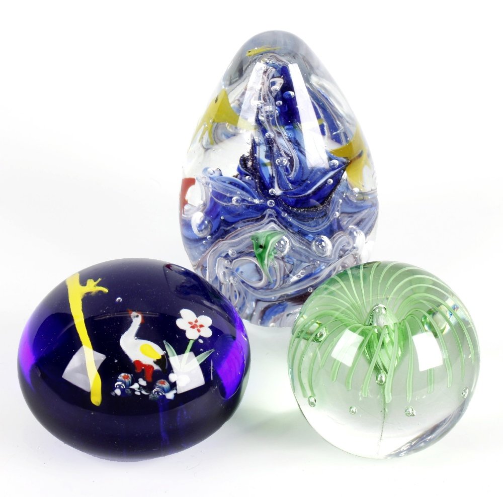 A large group of assorted paperweights