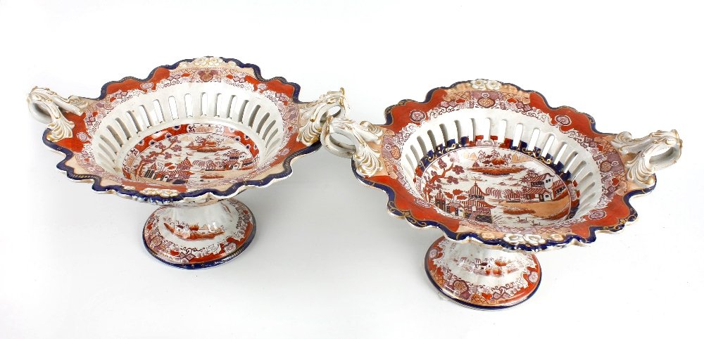 A pair of 19th century real ironstone china comports: A pair of 19th century 'Real Ironstone China' comports, each bowl with a wave edged rim and pierced bordered band, gilded scrolled carry handles and raised upon a spreading circular foot, each with pr