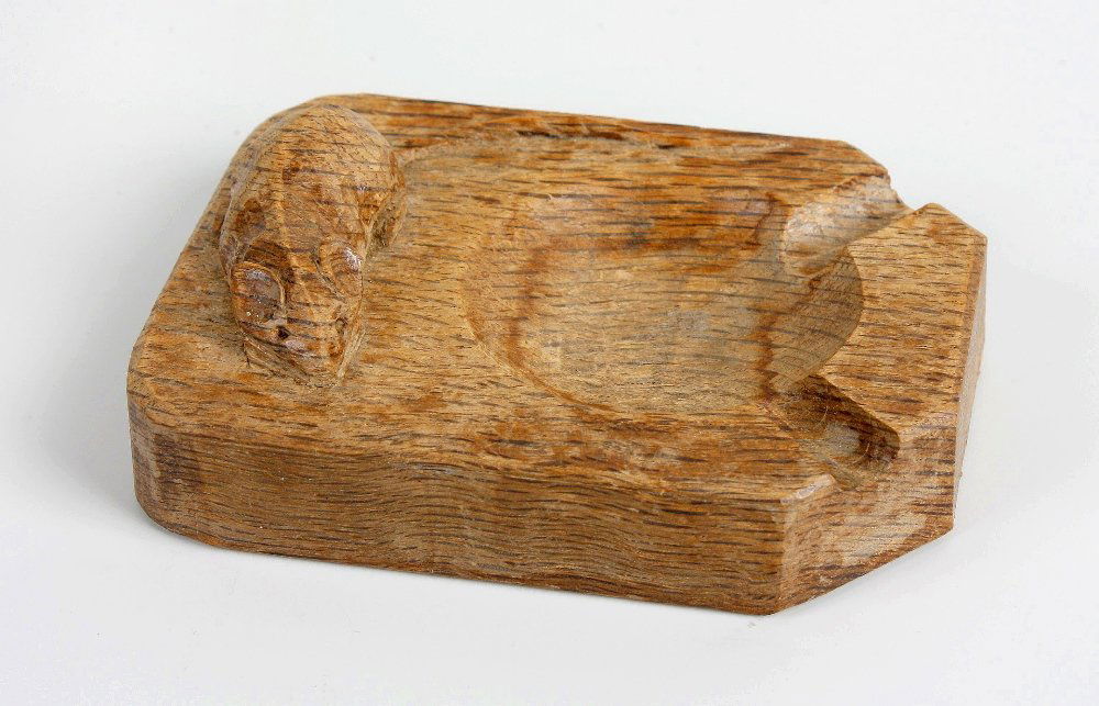 A 'Mouseman' oak ashtray: A 'Mouseman' oak ashtray.Workshop of Robert Thompson of Kilburn, North Yorkshire, of canted oblong form with typical carved mouse, 4" (10cm) long.