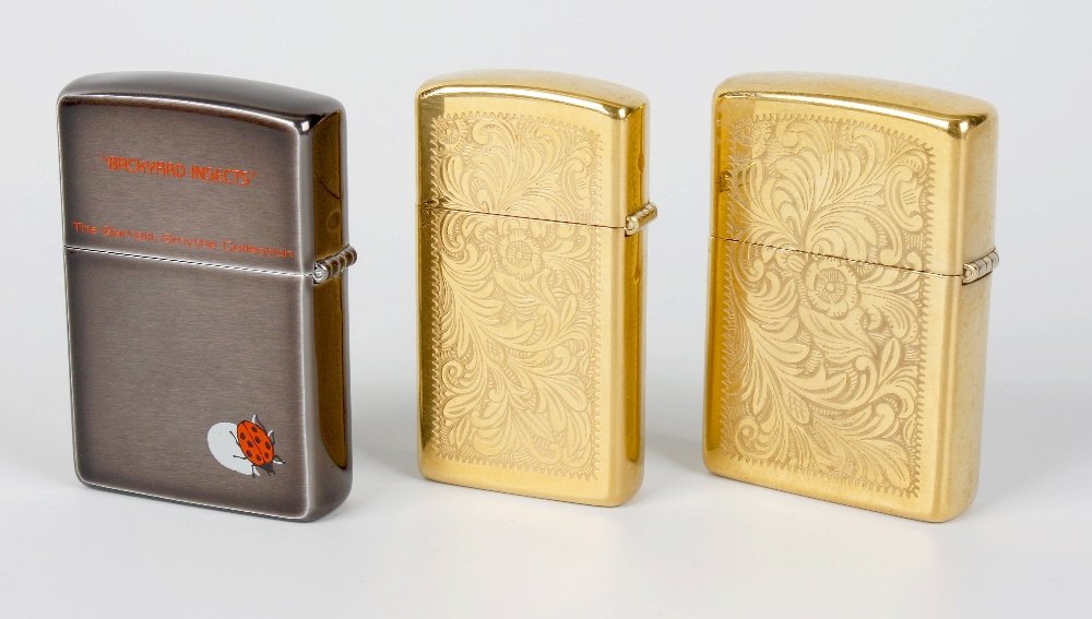 ZIPPO - a selection of three lighters.: ZIPPO - a selection of three lighters, to include a 'Backyard Insects' lighter with butterfly front panel design, together with two lighters, each with foliate engravings to the front and reverse. Sig