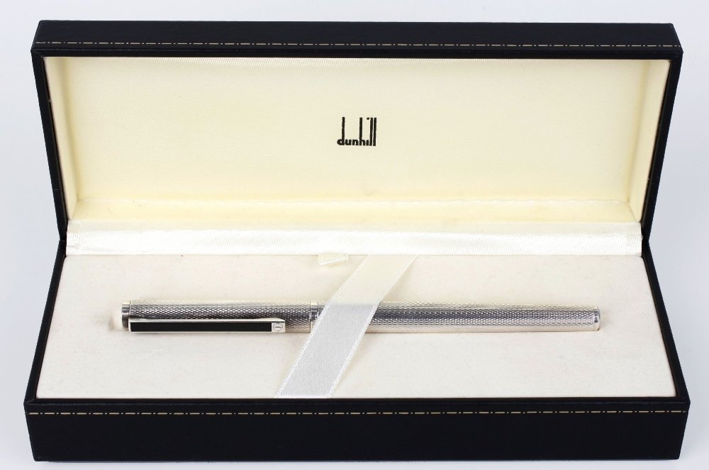 DUNHILL - a fountain pen: DUNHILL - a fountain pen, with textured casingand black resin clip. Signed Dunhill, Germany.Length 5.25", (13.8cm). With maker's case.