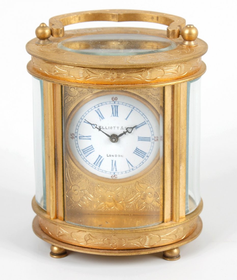 An oval 'mignonette' carriage timepiece. Retailed