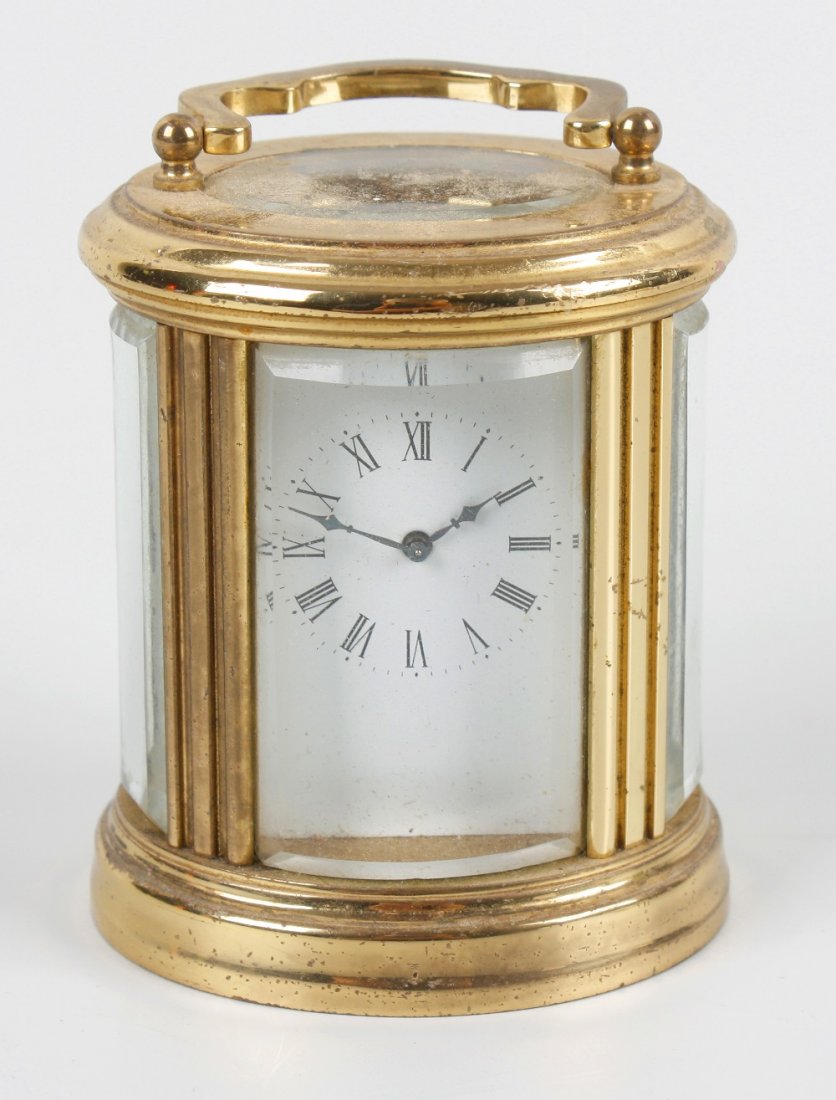 An oval 'mignonette' carriage timepiece