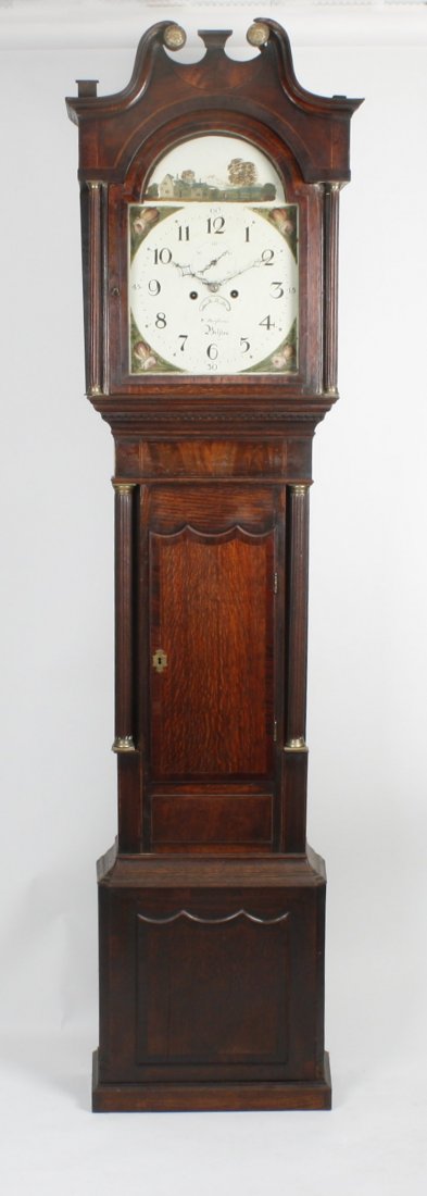 An early 19th century oak and mahogany cased longcase c