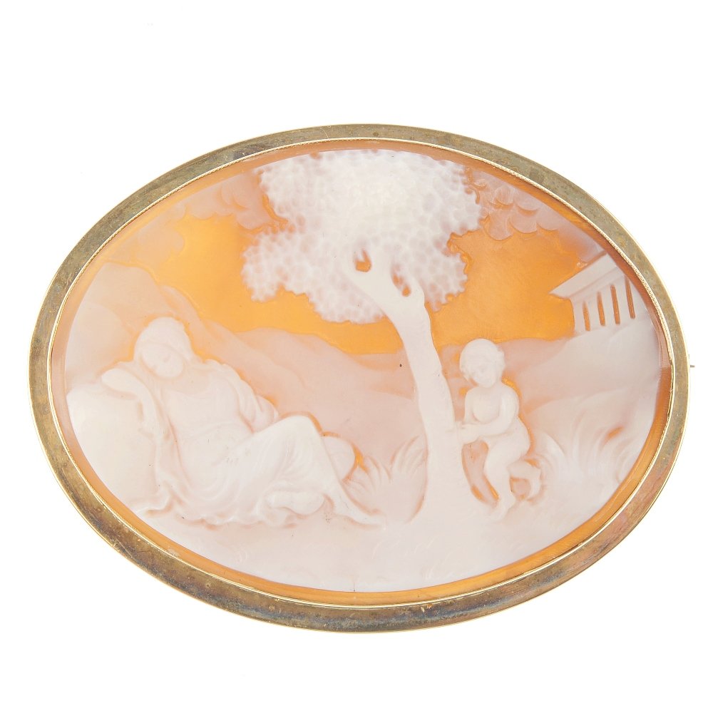 A 9ct gold shell cameo brooch.: A 9ct gold shell cameo brooch, the shell carved to depict a lady and a child resting by a tree, within a plain surround. Hallmarks for Birmingham, 1977. Length 6cms.