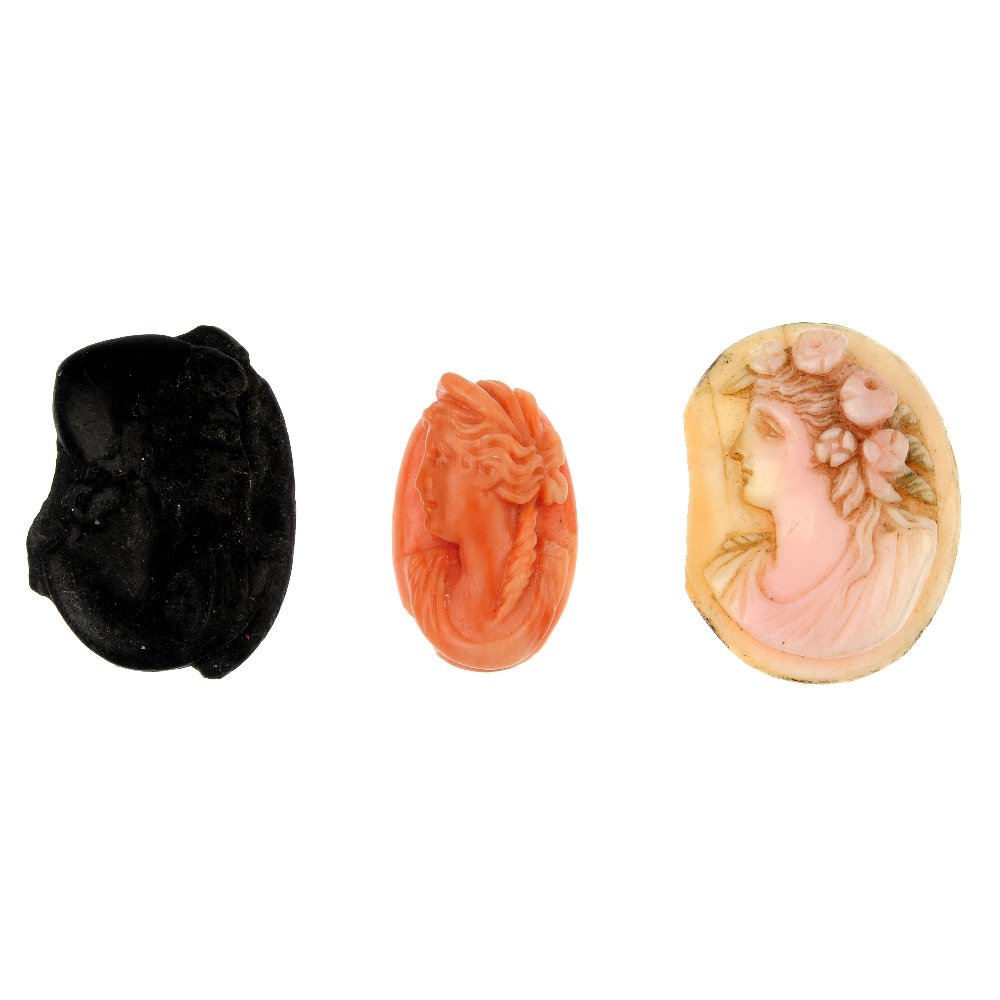 A selection of three cameos: A selection of three cameos, to include a coral cameo carved to depict Hera, a conch shell cameo carved to depict the profile of a lady with flowers in her hair and a slate cameo carved to depict a be