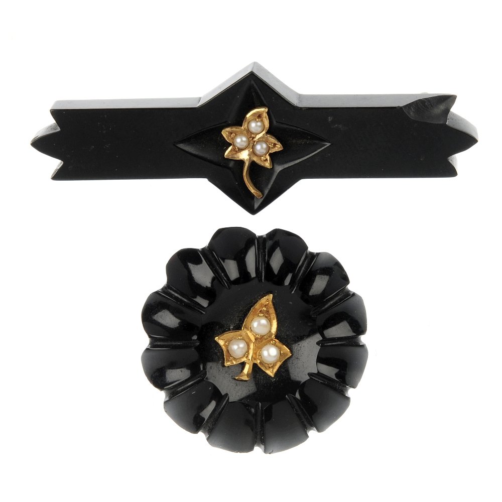 A selection of jet and bog oak jewellery.: A selection of jet and bog oak jewellery, to include two split pearl gold ivy leaf and jet brooches, a mother-of-pearl and bog oak ring, a shell cameo and jet pendant, together with a brooch and two l