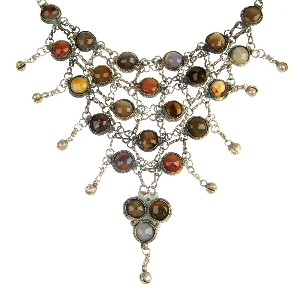 A selection of silver and white metal jewellery: A selection of silver and white metal jewellery, to include an openwork fringe necklace set throughout with circular-shape agate cabochons, a late 19th century silver curb-link charm bracelet and a pa