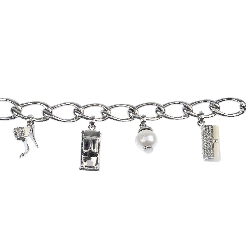 DKNY - a selection of jewellery.: * DKNY - a selection of jewellery, to include a charm bracelet, a paste band ring and a pair of paste ear hoops. (19) Stamped DKNY, steel.