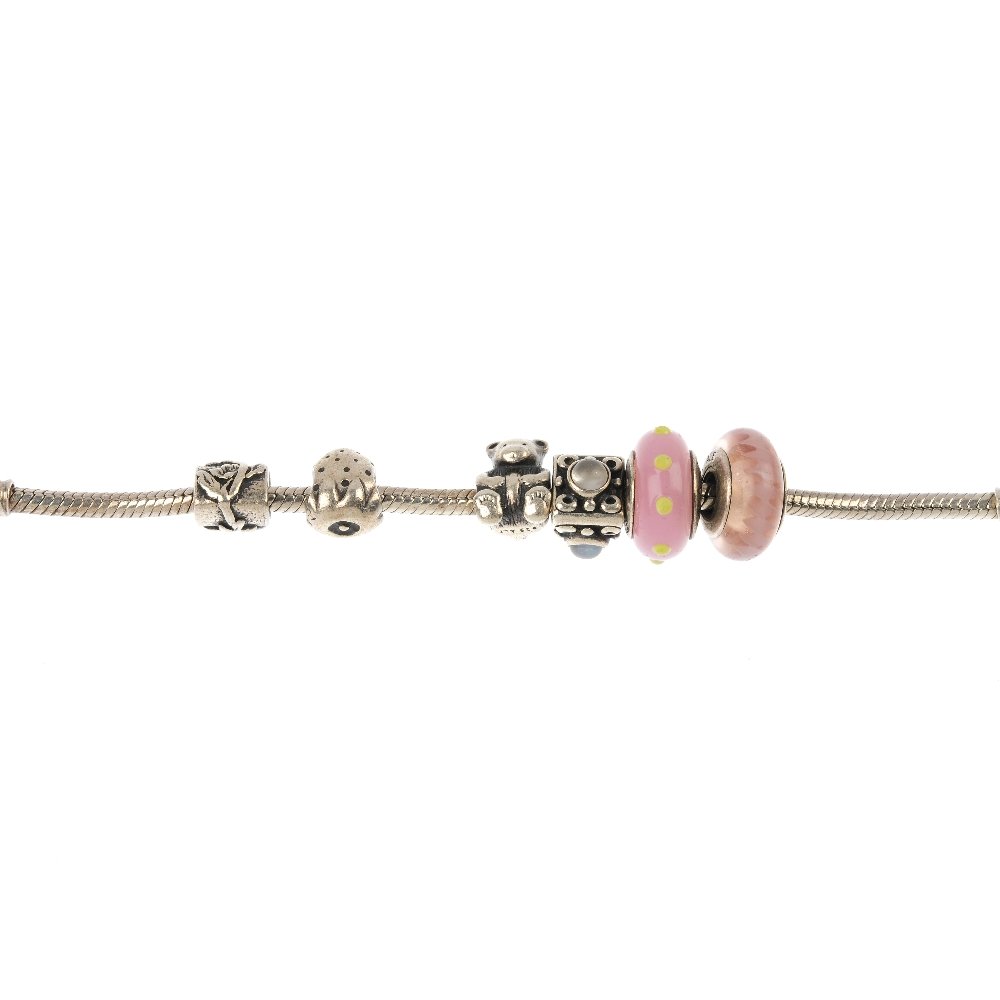 PANDORA - three charm bracelets with charms.: PANDORA - three charm bracelets with charms, the first designed as a snake-link chain comprising six charms, together with two similar bracelets each comprising seven charms. Each bracelet with hallma