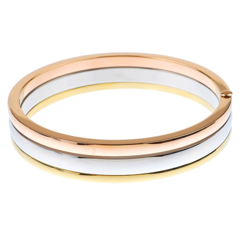 A quantity of costume jewellery.: * A quantity of costume jewellery, to include a DKNY bangle, a triangular-shape paste cluster ring and a pair of cufflinks. (19) Some AF. Paste deficient to some.