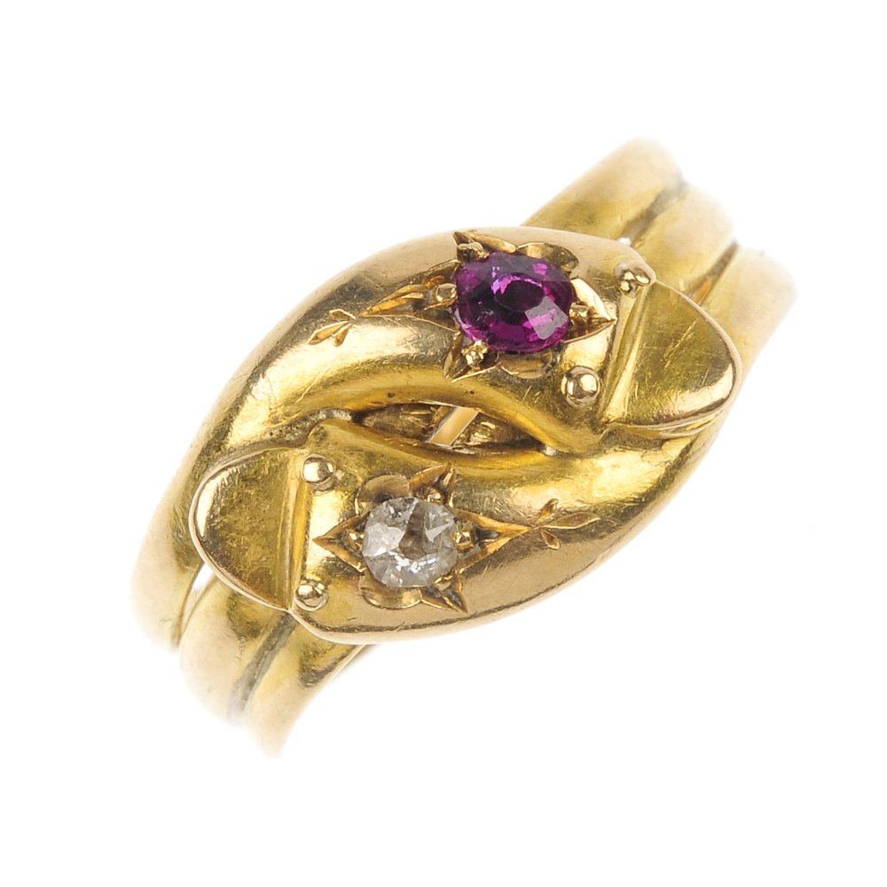 An Edwardian 18ct gold ruby and diamond snake ring.: An Edwardian 18ct gold ruby and diamond snake ring. Designed as a pair of coiled snakes, with circular-shape ruby and old-cut diamond crests. Hallmarks for Chester, 1907. Weight 4gms.