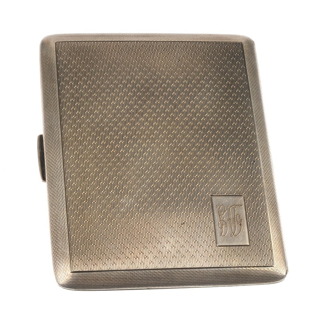 A 1960s silver cigar case, together with a silver cigar: A 1960s silver cigar case, together with a silver cigar cutter. The first of rectangular-shape outline with engine turned surface retail, the second of rectangular-shape outline surface screw detail. 