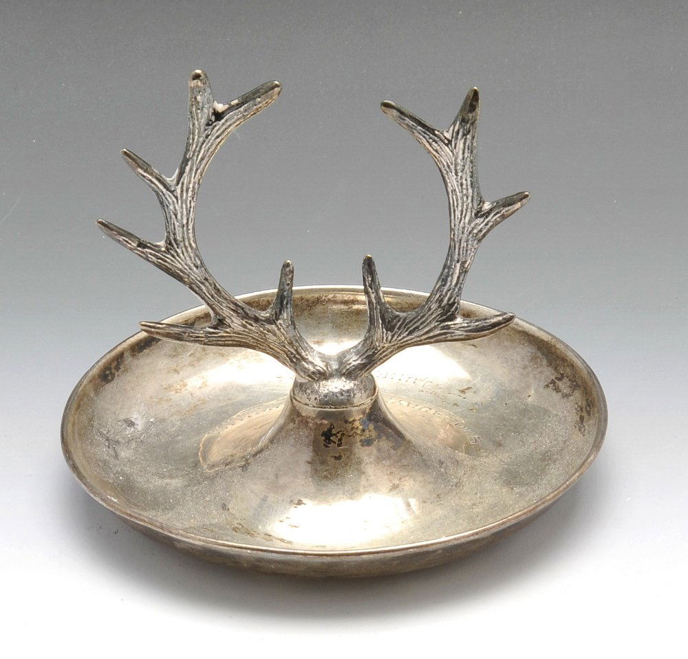 An Edwardian silver ring tree and early 20th century in: An Edwardian silver ring tree on circular base with personal engraving and central antler tree, hallmarked Mappin & Webb Ltd, Birmingham 1904. Together with an early twentieth century silver mounted i