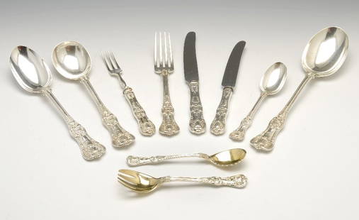 A Tiffany & Co sterling silver part canteen in Queen's : A Tiffany & Co sterling silver part canteen for twelve place settings in a double struck Queen's style pattern with engraved monogram to terminal, comprising twelve each of table knives, side knives,