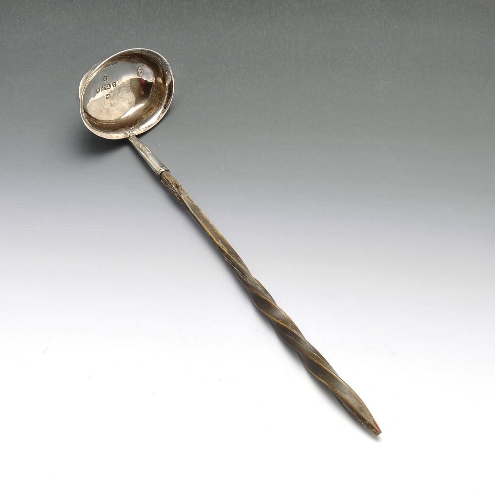 A William IV silver sauce ladle.: A William IV sauce ladle with spiral twist baleen handle leading to a plain silver oval bowl with everted rim. Hallmarked Taylor & Perry (John Taylor & John Perry), Birmingham 1833. Length measures 6